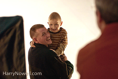 photographer taking photo of dad and son - copyright Harry Nowell