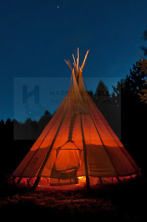 Photo of teepee at night